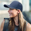A female model wearing a navy cap