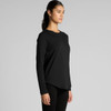 A long-sleeve black tee displayed on a model, featuring a curved hem and a simple design. It has a logo on it.