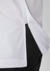 A white jacket with a zip along the side, featuring a black panel below and a logo detail.