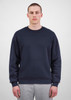 A navy blue men's crew sweatshirt displayed on a model, featuring a simple design and equipped with a logo.