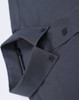 A dark grey cotton blend long-sleeve shirt with a folded collar and button details. It features a logo.