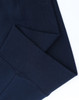 A close-up of the cuff detailing on a navy unisex premium fleece oversized hoodie, featuring a ribbed texture.