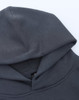A grey unisex premium fleece oversized hoodie with a large hood, featuring a branding label.