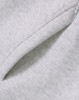 A close-up of a soft, grey fleece fabric featuring a folded edge, showcasing the texture.