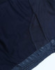 A navy hooded puffer jacket featuring a lightweight design and mesh detailing on the interior lining.