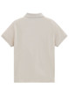 A light beige ladies' short-sleeve polo shirt with a collar, featuring a logo on the back.
