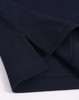 A navy blue men's ultrafine cotton pique polo, featuring a close-up view of the fabric and seam details.