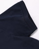 A navy blue men's ultrafine cotton pique polo, featuring a collar and sleeve detail. The product includes branding.