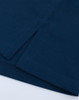 A close-up of a navy ultrafine cotton pique polo, featuring textured fabric and clean hems.