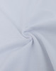 A close-up view of soft, ultrafine cotton pique fabric in white, showcasing its texture and weave.