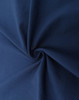 A close-up of navy blue fabric, showcasing its smooth texture and durability. The fabric has a slight sheen.