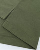 An olive green men's polo made from high-performance graphene fabric, featuring smooth seams and a modern design.