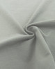 A close-up of a soft, grey fabric in a spiral formation, showcasing its smooth texture.