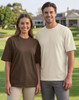 A brown and a cream unisex heavy cotton oversized tee worn by two models in an outdoor setting.