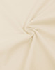 A close-up of light beige fabric, showcasing a smooth, oversized cotton texture with a flowing twist.