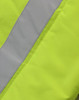 A close-up of a bright yellow fabric with a grey reflective stripe, part of a hi-vis hooded puffer vest.