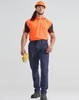 A worker models DWR water repellent flexi work pants in navy, paired with an orange shirt and safety gear.