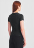 A women's black baby tee viewed from the back, featuring a fitted design and short sleeves.