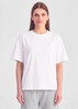 A white box tee featuring a relaxed fit, displayed on a model against a plain background.