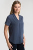 A women's button-up shirt in a navy blue colour with short sleeves and a v-neck design. It features a logo.