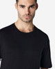 A black Gildan Softstyle adult T-shirt displayed on a male model against a neutral background.