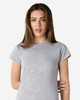 A grey Gildan Softstyle Ladies' T-Shirt displayed on a model, featuring a casual fit and short sleeves.
