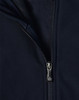 A navy softshell high-tech jacket featuring a zippered front and a fleece lining. The jacket includes a logo.