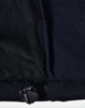 A close-up of a black ladies softshell jacket, highlighting the inner lining and adjustable hem detail.