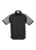 A black and grey short sleeve button-up shirt with a logo on the chest and contrasting panel details.
