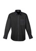 A black long sleeve button-up shirt with a chest pocket and a collar. It features a logo on the label.
