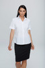 A short-sleeve button-up shirt in white, paired with a black skirt, featuring a logo.