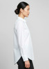 A long-sleeve white button-up shirt with a straight cut and side splits, featuring a logo on the label.