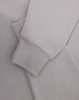 A light grey polar fleece jumper featuring a half zip collar and fitted cuffs. It has a subtle logo.