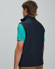 A navy men's softshell vest with a high collar, featuring a logo on the back, displayed on a model.