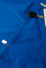 A blue men's scrub top featuring a badge holder and a security reel. The fabric has a smooth texture.