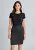 A woman stands wearing a black top and a dark grey pencil skirt. The skirt features a sleek design and a waistband.