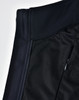 A close-up of a black ladies' softshell hi-tech vest showcasing its fabric textures and a zippered pocket.