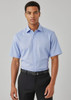 A light blue short sleeve button-up shirt, featuring a collar and a logo, worn with black trousers.