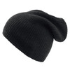 A black beanie made of ribbed fabric, featuring a slouchy design and a discreet logo.