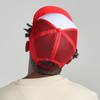A red and white trucker cap featuring a mesh back and a logo at the rear.