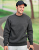 A dark grey crew neck fleece sweatshirt with a relaxed fit, worn by a man outdoors, paired with a cap.