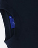 A navy crewneck sweatshirt with a ribbed collar and a logo tag visible on the inside seam.