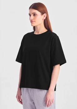 A black box tee with short sleeves, displayed on a model against a plain background.