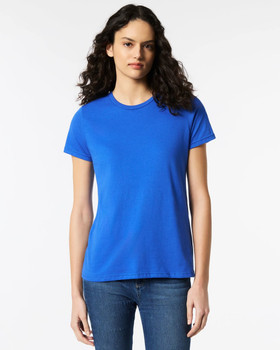 A blue Gildan Softstyle ladies' t-shirt displayed on a model, featuring a simple design and round neckline.