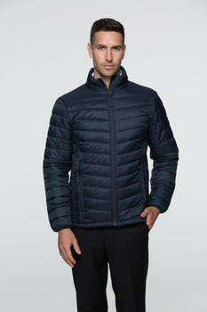 A man wearing a navy blue puffer jacket with a zip front and a stand-up collar, featuring a branding logo.