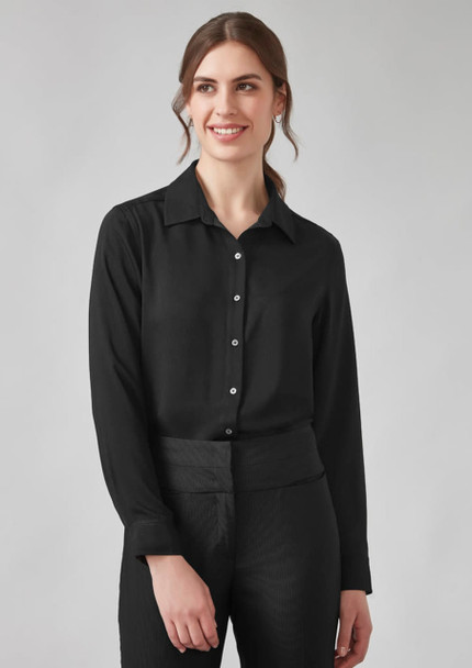 A black long sleeve shirt for women with a collared neck and button-up design. The model is wearing it with black trousers.