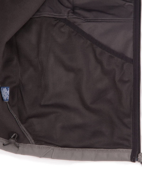 An inside view of a men's softshell high-tech jacket featuring a mesh pocket, predominantly grey in colour.