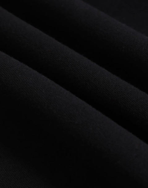 A close-up of black polar fleece fabric, showcasing its soft texture and layering. The image features a logo.