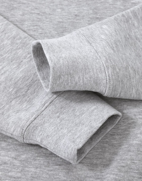 A grey crew fleece sweater featuring long sleeve cuffs and a soft texture, with a logo present.
