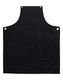 A black canvas bib apron featuring a front pocket and brass eyelets. It has a simple, sleek design.